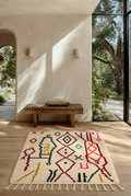 Amazigh's Art azilal berbere marocain Handmade Moroccan Berber wool rug with colorful geometric patterns in a bright modern room