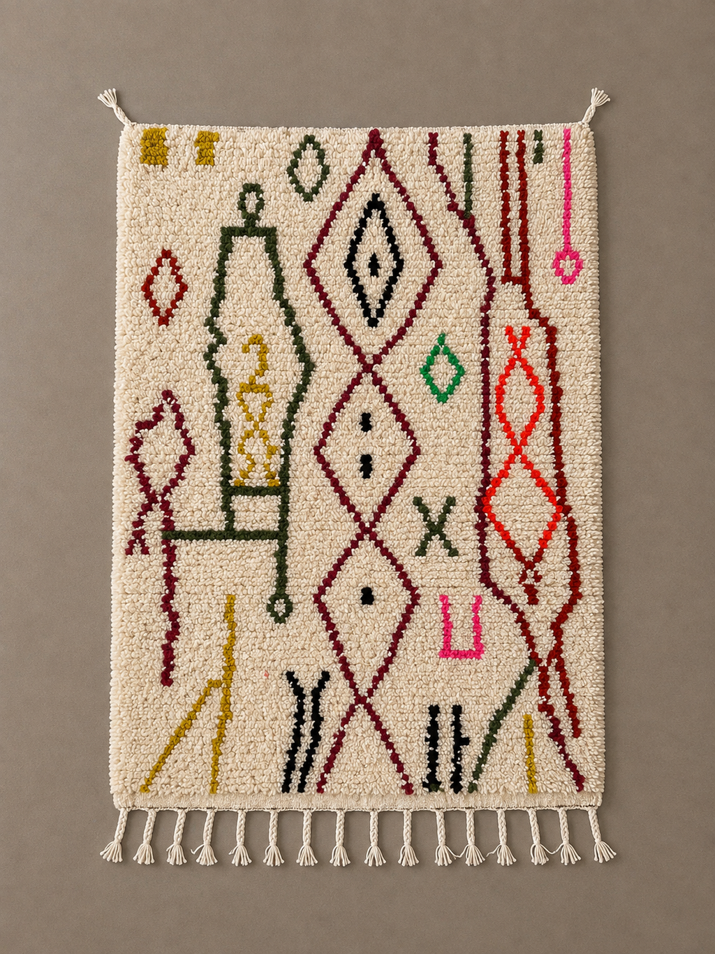 Amazigh's Art azilal berbere marocain Handmade cream Moroccan Berber wool rug with colorful abstract geometric patterns and tassels.